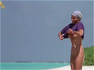 magnificent Bo Derek flashing off her furry labia at the beach